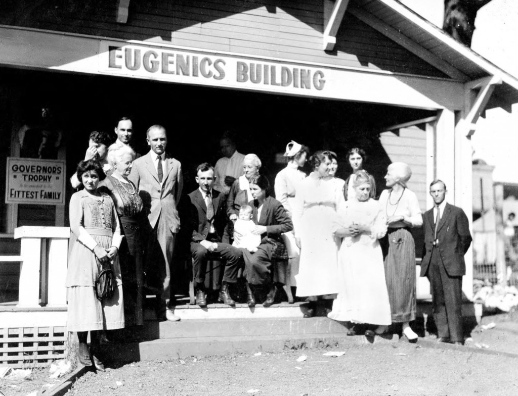 Winning family of the Fittest Family award stand outside of the Eugenics Building, 1925